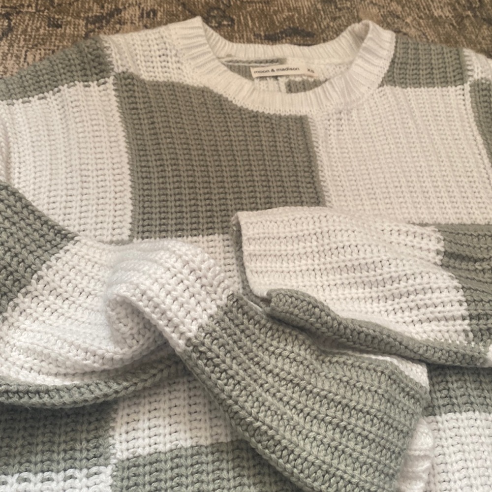 Cropped green and white checkered sweater.